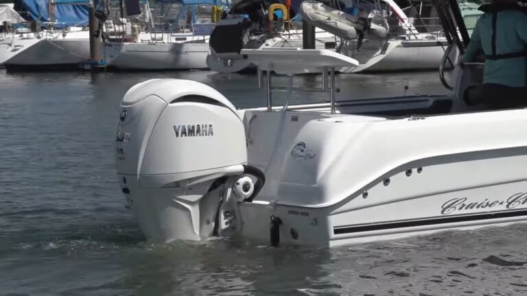 a 300 kg motorboat is turned off as it approaches